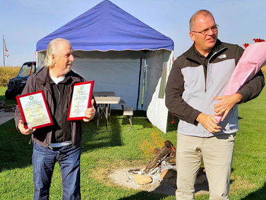 Richard Packer Sr. (left) receives two prestigious awards from the FAA.